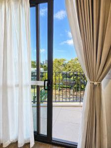 a window with a view of a balcony at Auburn Studio, Entire Studio with Ensuite toilet and kitchen in Sydney
