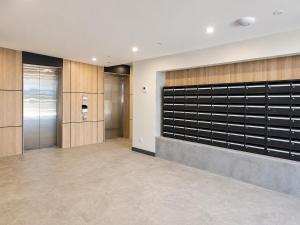 a lobby with a walk in closet and elevators at Auburn Studio, Entire Studio with Ensuite toilet and kitchen in Sydney