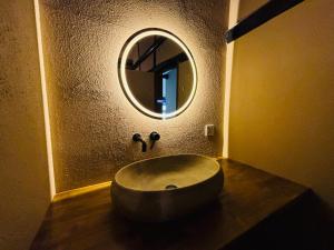 a bathroom with a large sink and a mirror at La Terra Hirasawa in Shiojiri