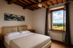 a bedroom with a bed and a large window at Villa La Gioconda - Heated Pool and Gym in Arezzo +83 photos