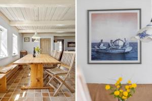 a dining room with a table and a picture of a boat at LF10211-Thyholm-Ronbakken-11 in Thyholm