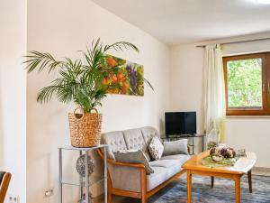 a living room with a couch and a table at Zur Kapellenwiese in Oberthal