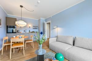 a living room with a couch and a table at The Break Hotel in Herning