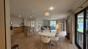 a kitchen and living room with a table and chairs at Hook Wine & Sinker in Dunsborough