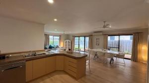 a kitchen and dining room with a table and chairs at Hook Wine & Sinker in Dunsborough +11 photos