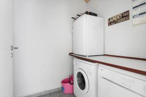 a laundry room with a washer and dryer at 6715-Hasle-Skovkanten-12 in Hasle