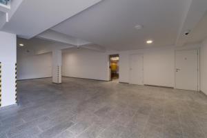 an empty room with white walls and a tile floor at Luxurious Sea-view 3BR Apartment with Private Pool-Villa Quadris-Crikvenica in Crikvenica +57 photos