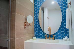 a bathroom with a sink and a mirror at Faranda Collection Cali, a member of Radisson Individuals in Cali +132 photos