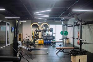 a gym with weights and equipment in a room at Faranda Collection Barranquilla, a member of Radisson Individuals in Barranquilla