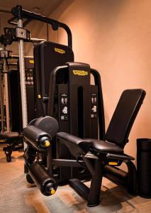 a black chair in front of a gym at Alpine Boutique Hotel wollée - 4 Star Superior in Schladming