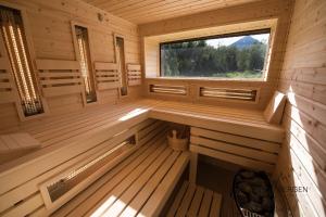 an inside view of a sauna with a window at Chata Bergen in Vysoké Tatry