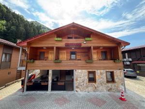 a building with a sign on the front of it at Desera Pansiyon in Uzungöl