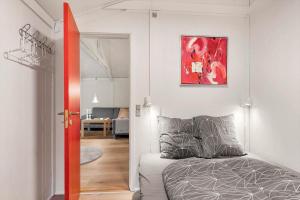 a bedroom with a bed and a living room at JB353-Brovst-Hjortevaenget-13 in Brovst