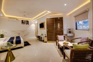 a hotel room with a bed and a table and chairs at Hotel Delhi 37 by Star Group in New Delhi