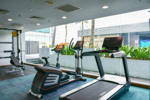 a gym with a treadmill and a computer in a room at Premiere Hotel - Complimentary Shuttle to Klang Wholesale Market in Klang