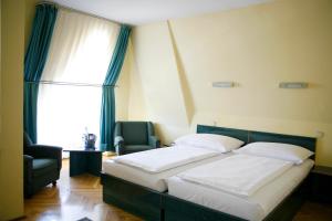 Posteľ alebo postele v izbe v ubytovaní Hotel Bara Budapest + 33 fotografií