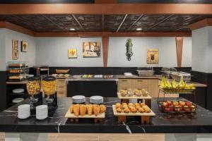 a kitchen with a table with food on it at Le Parc Gatineau, Tapestry Collection by Hilton in Gatineau