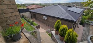 an overhead view of a house with potted plants at Ararat Terrace House in Ashtarak