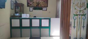 a room with a counter in a room at Griya Imafa Inn Batu in Tlekung