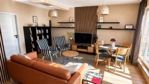 a living room with a couch and a table at Apartment Mira in Ružomberok