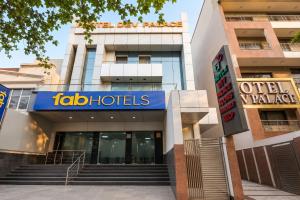 a building with a sign for a hotel at FabHotel Dev Palace II - Nr Ashok Vihar in New Delhi
