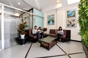 a group of people sitting in a waiting room at FabHotel Harsh Paradise - Malviya Nagar in Jaipur