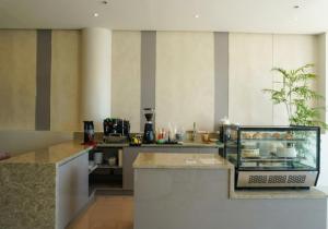 a kitchen with a counter with a counter top at Ace Penzionne by Hiverooms in Pajo