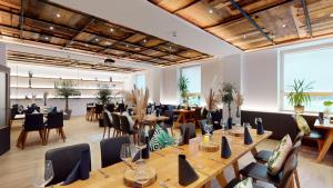 a large room with tables and chairs in a room at Monteurzimmer in Nordhausen