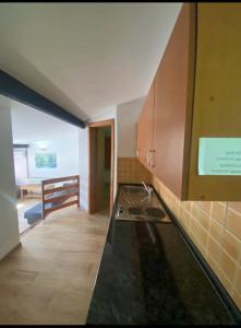 a kitchen with a sink and a counter top at Camp Rooms in Jajce