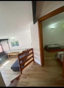 a room with a room with a bed and a mirror at Camp Rooms in Jajce