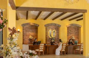 a bride and groom sitting at a table in a salon at U Khao Yai in Mu Si +113 photos