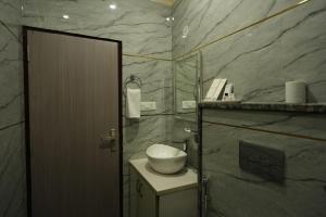 a bathroom with a shower with a toilet in it at Hotel Sharma Jaipur in Jaipur +30 photos