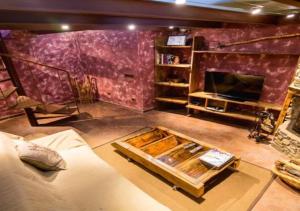 a living room with a couch and a fireplace at Casa Rural Mariola in Ordino