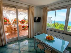 a dining room with a table with a bowl of fruit at Chez Marie Ischia in Forio d'Ischia