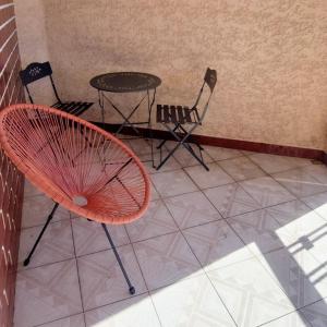 a chair and a table and chairs in a room at Meira House in Belinho +16 photos