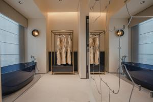 a dressing room with two sinks and two mirrors at PingYao Chengfu Jinyuan Hotel in Pingyao