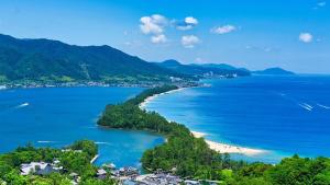 an aerial view of a beach and the ocean at The CATAN 宮津 in Yura