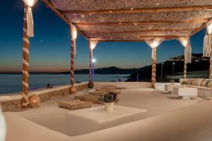 a gazebo with a view of the water at Silia Dream View in Houlakia
