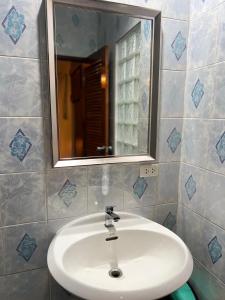 a bathroom with a white sink and a mirror at Bungalow Apartment Kamala in Phuket +21 photos