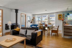 a living room with a couch and a table at 136-Snedsted-Lykkens-Hab-23 in Snedsted