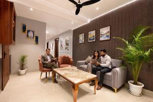 a group of people sitting in a waiting room at FabHotel Prime The Ballroom - Near GD Goenka University in Gurgaon