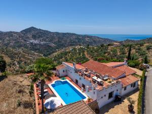 an aerial view of a house with a swimming pool at Casa Azafranes - Boutique B&B - Arenas in Arenas