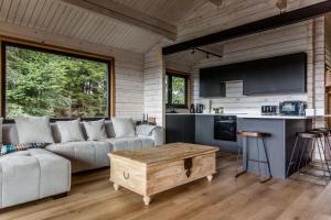 a living room with a couch and a table at The Larch House in Chester