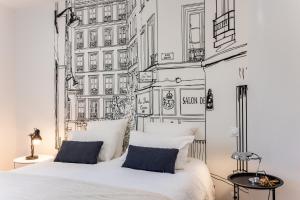 a bedroom with a bed and a wall with buildings at Château Puybarban in Puybarban +56 photos