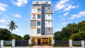 a white building with aventh floor at Urban Comforts - Near US Consulate Business Hotel in T Nagar in Chennai