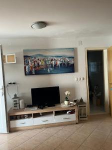 a living room with a flat screen tv on the wall at Ferienhaus Vedran in Vir