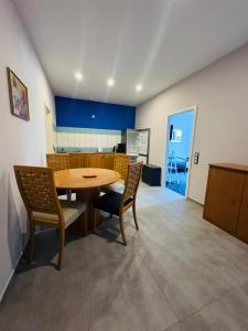 a dining room with a table and chairs at Hostel in Böhlen +19 photos