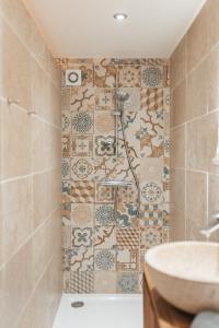 a bathroom with a shower and a sink at Chez Gabriel et Sophie in Pérouges +23 photos