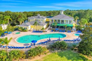 an aerial view of a pool at a resort at Exclusive 3BR villa: pools near Disney magic in Kissimmee