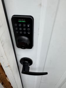 a door with a black remote control on it at Green Clover Hideaway in Draper +6 photos
